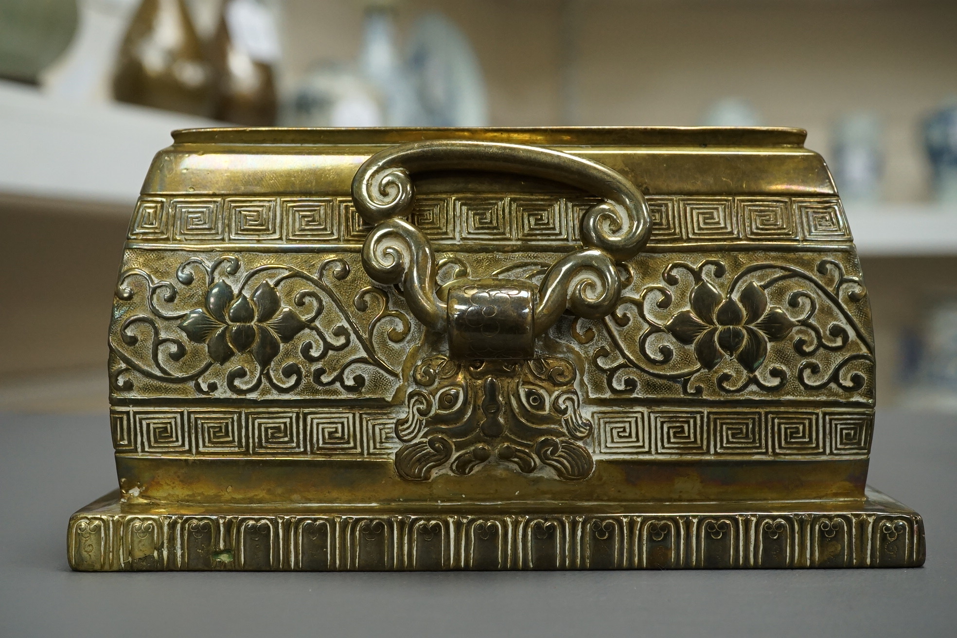A large Chinese bronze rectangular censer and cover, Xuande seal mark, and a ‘plum blossom and chilong’ bronze censer, both 19th century